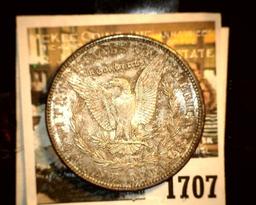 1707 _ 1903 P U.S. Silver Morgan Dollar, Choice BU 63. Gold toning.