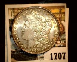 1707 _ 1903 P U.S. Silver Morgan Dollar, Choice BU 63. Gold toning.