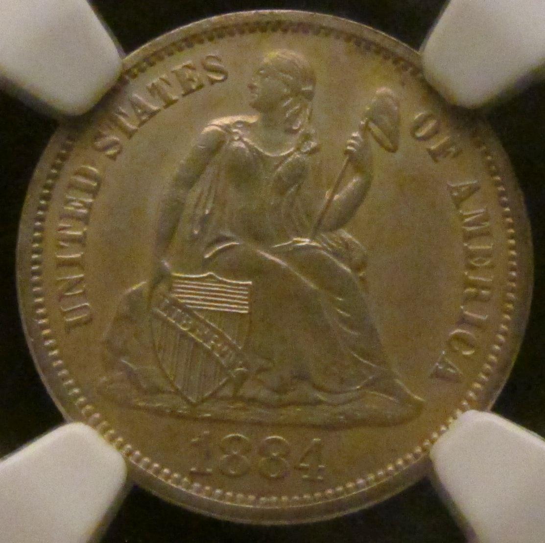 1884 U.S. Seated Liberty Dime NGC slabbed "1884 10C PROOF Stained". Only 875 minted.