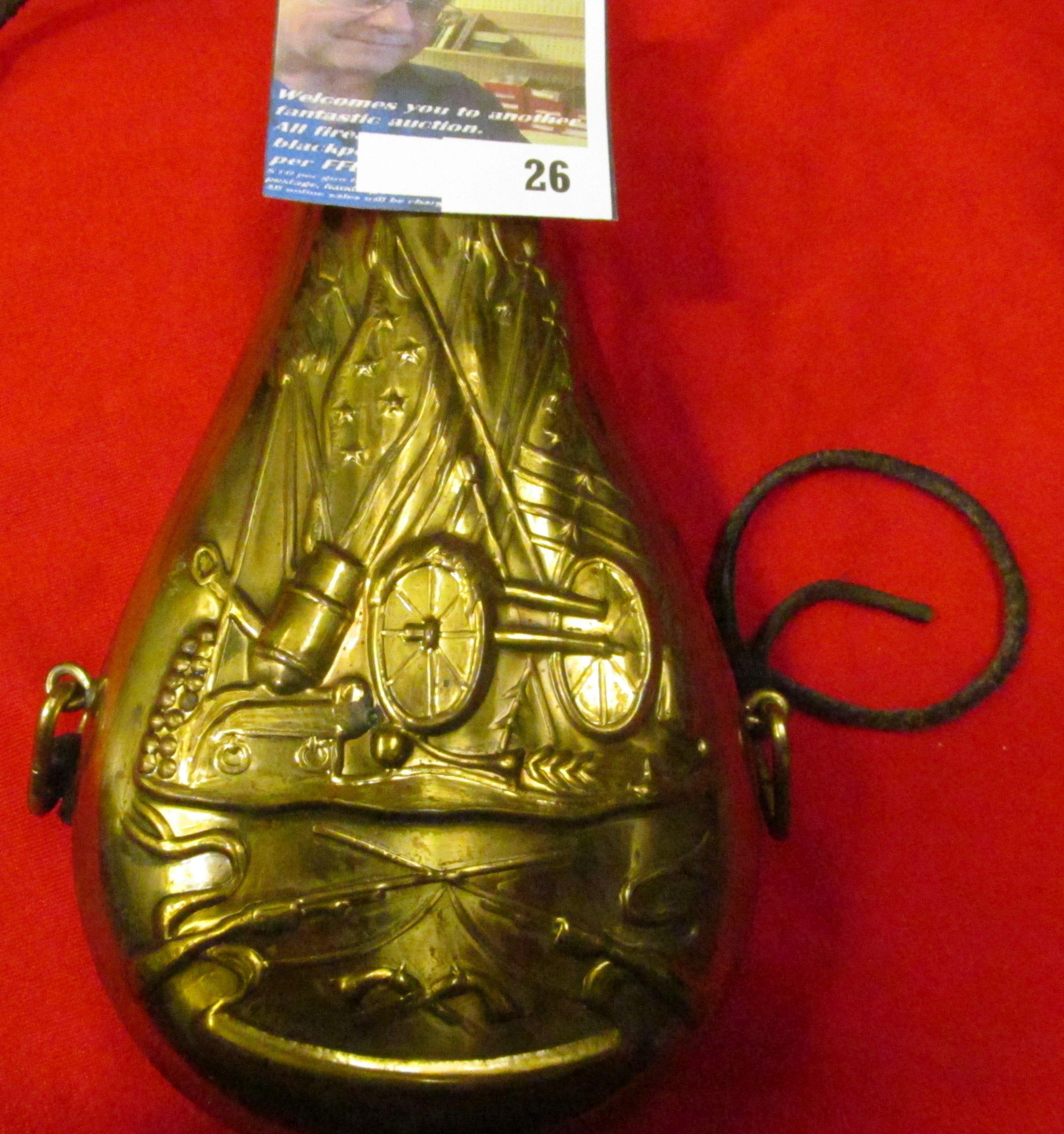 Brass Black Powder Flask with leather strap, depicts early U.S. Flags, mortar, cannon, and firearms