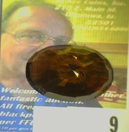 Oval faceted Precious Smokey Topaz weighing 47.12 carats and ready for mounting. Excellent color and