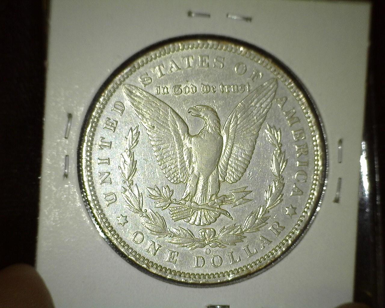 1895 O Key date Morgan Silver Dollar with a few rim ticks.