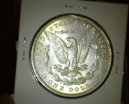 1897 P Morgan Silver Dollar, Brilliant Unc with a hint of toning.