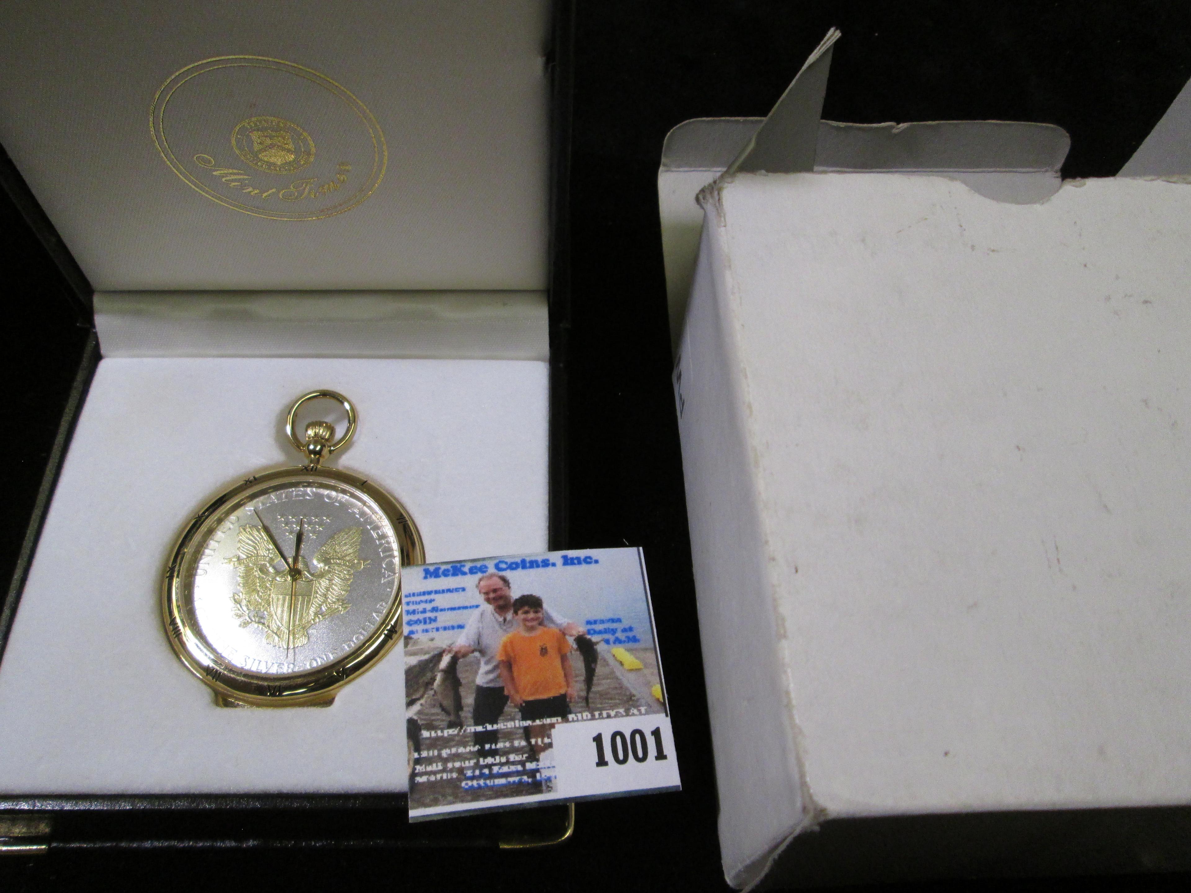 Gold-highlighted Silver American Eagle Dollar Pocket Watch, in original box. Not running, most likel