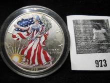 1999 Silver One Ounce .999 American Eagle Dollar, colorized and stored in a capsule.