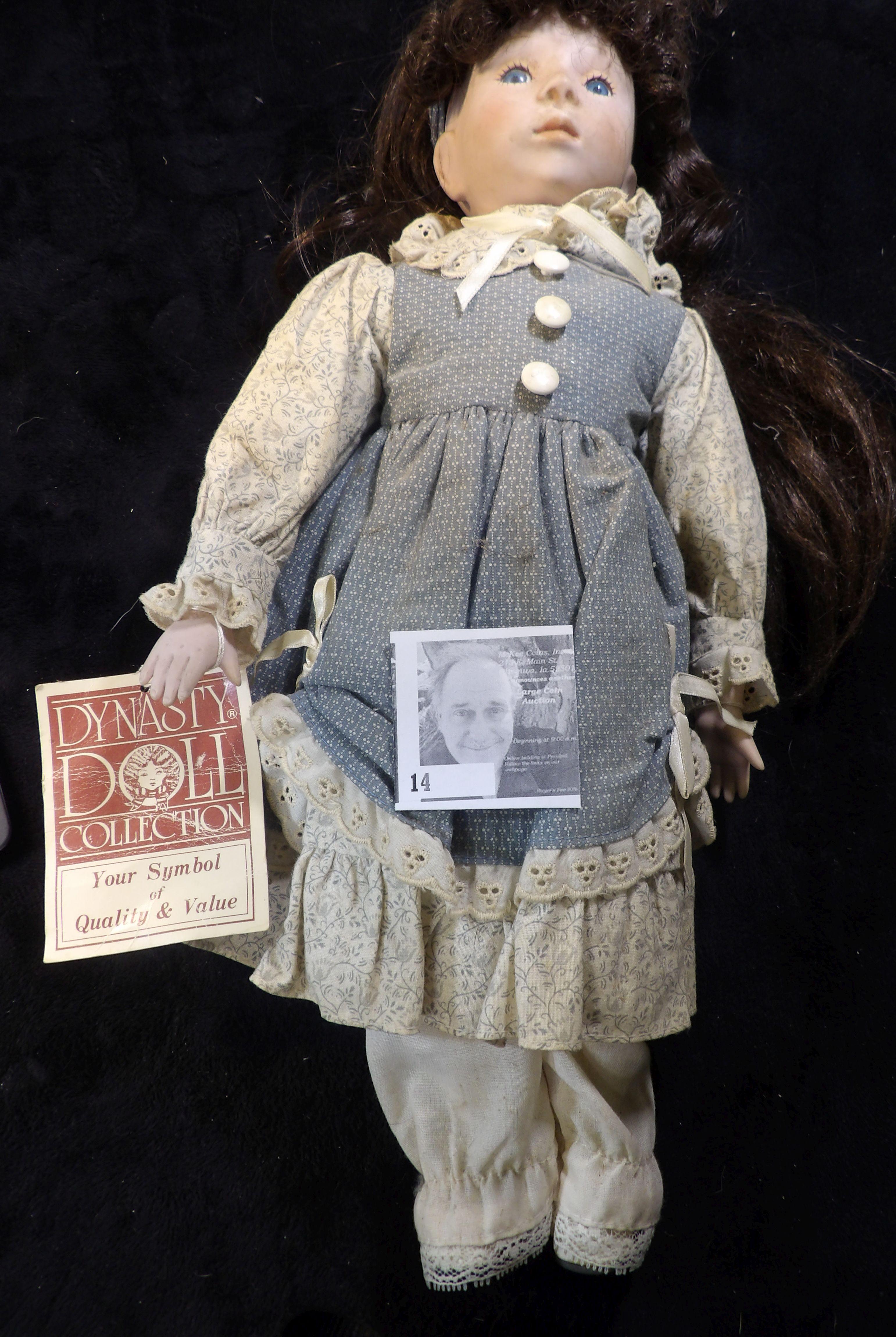 Over 16" tall Dynasty Doll with hang tag. Dynasty dolls are made from fine tinted porcelain bisque p