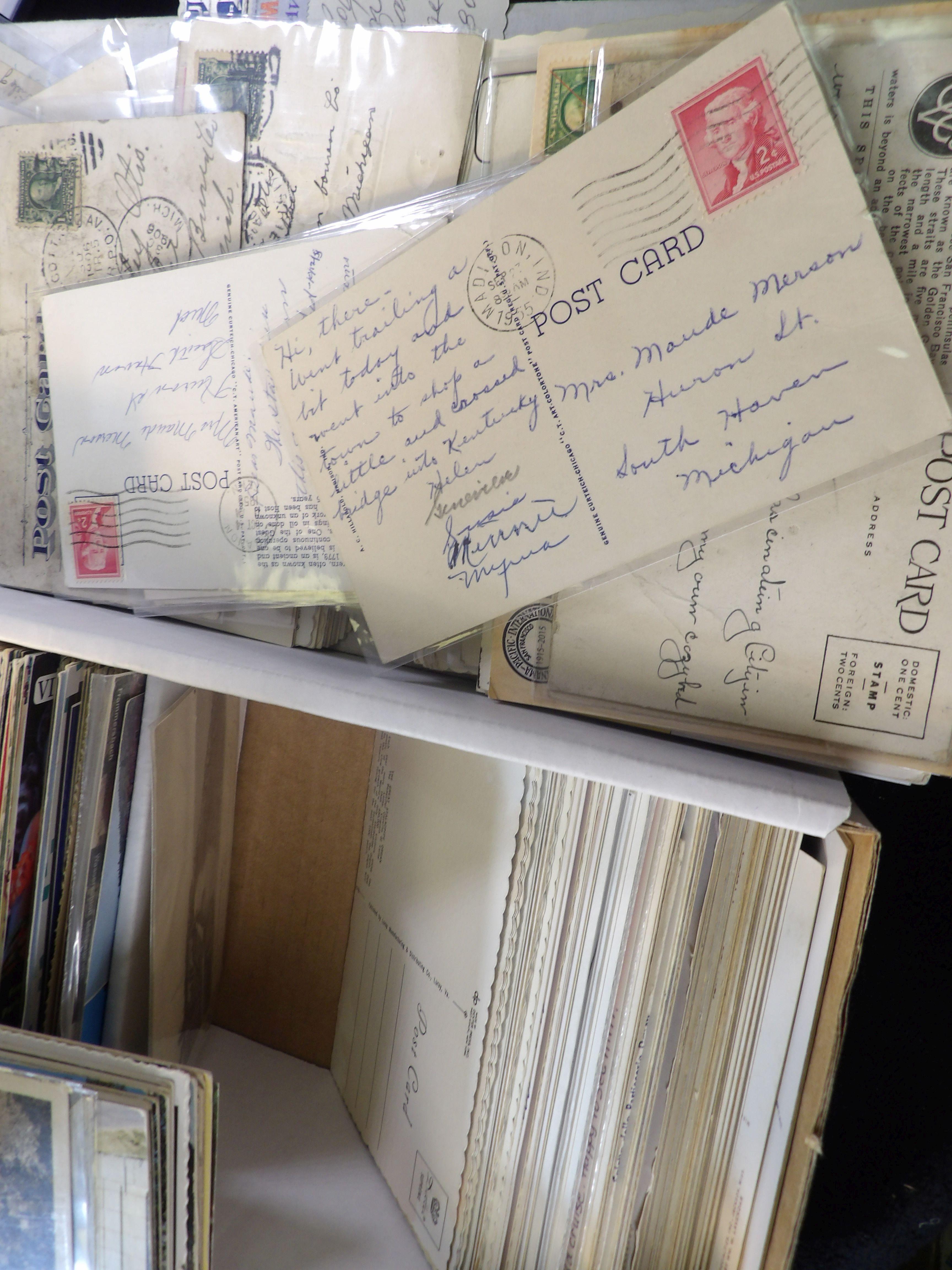 Approximately 900 Old Post Cards in a Postal Card box. Many have interesting Post Marks and cancelle