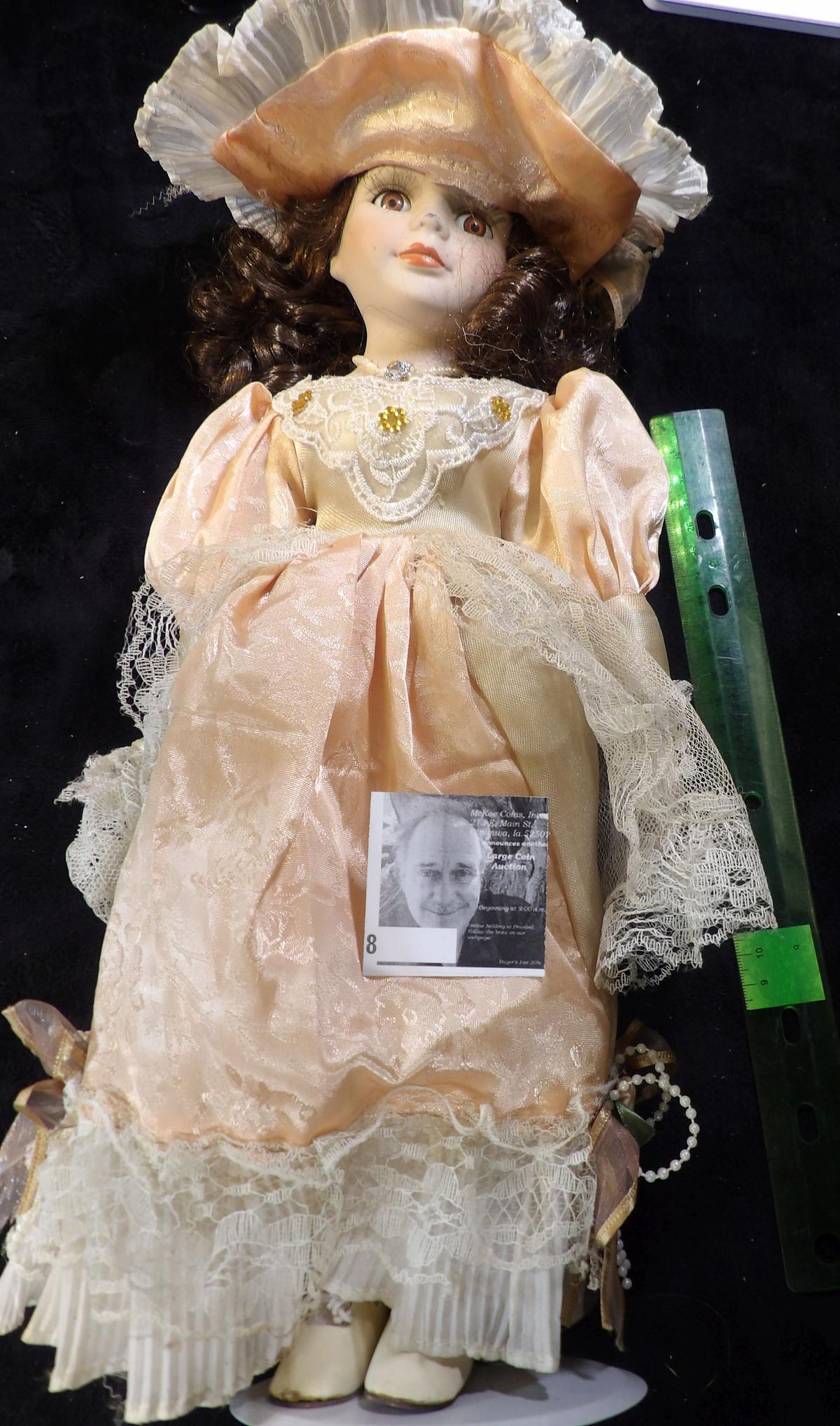 Lovely Brown-haired female Doll with lace Dress and hat, on stand. A little over 14" in height. Carr