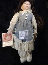 Over 16" tall Dynasty Doll with hang tag. Dynasty dolls are made from fine tinted porcelain bisque p