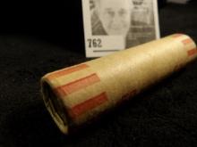 What appears to be a bank wrapped roll of unsorted Old Wheat Cents.