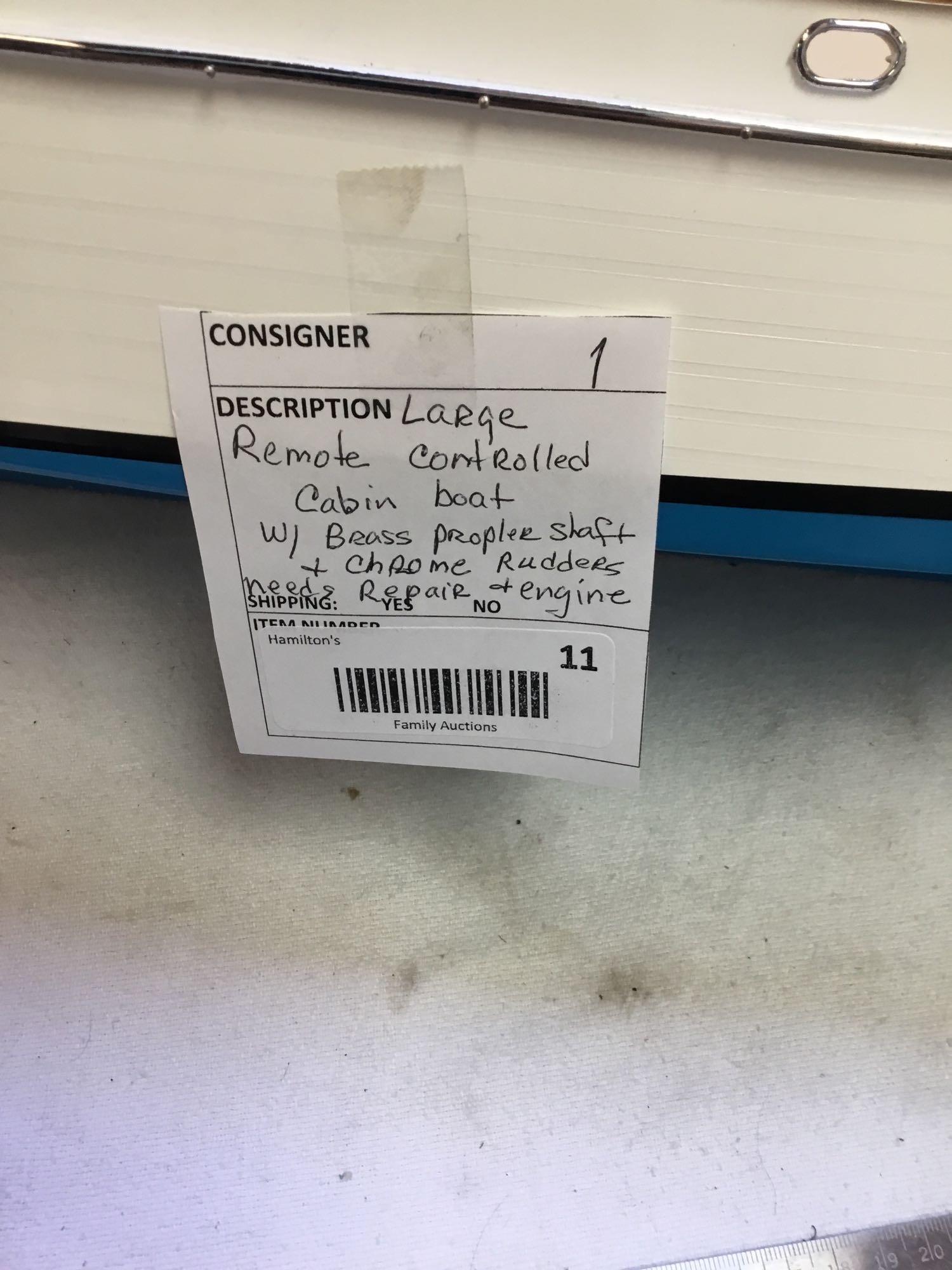 large remote controlled cabin boat with brass propeller shaft and chrome rotors needs repair in