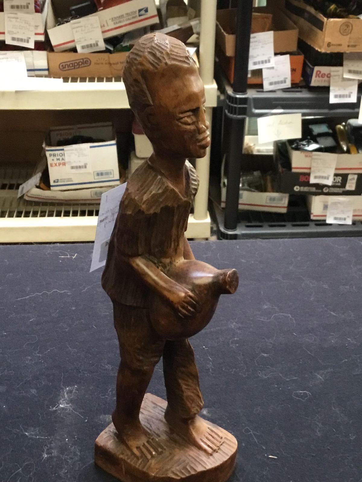 vintage hand, carved figure of boy with water jug