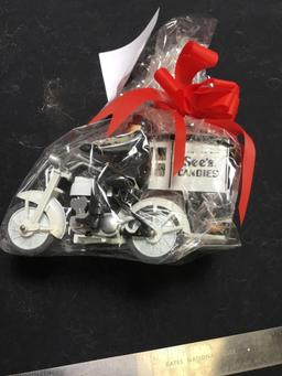 sees candies, wrapped candy, gift motorcycle with a sidecar