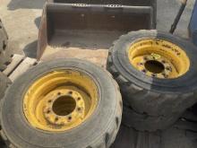 (4) Used Solid Skid Steer Wheels w/ Tires