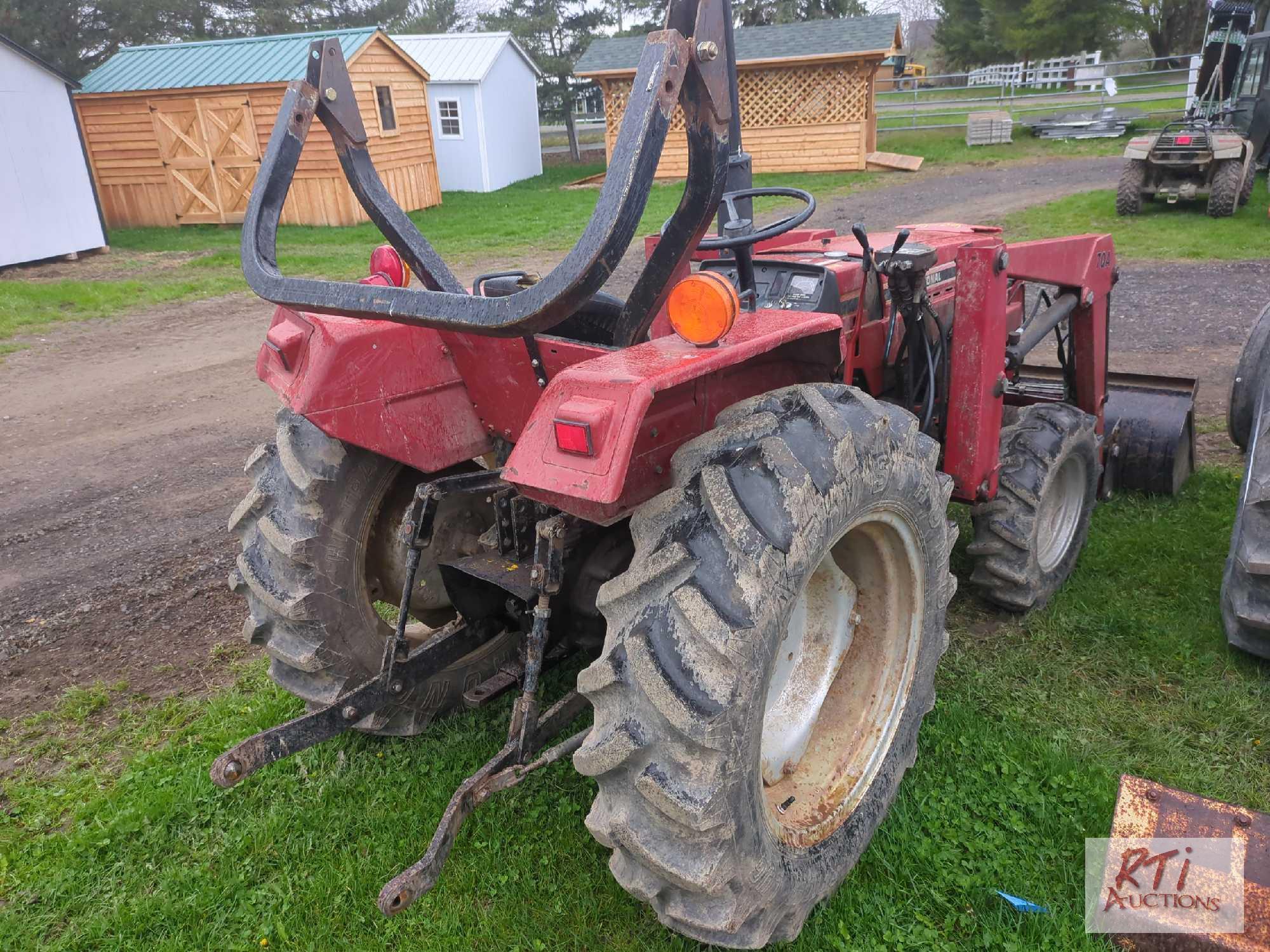 International 244 compact tractor, loader, GP bucket, lift arms, PTO, draw bar, differential lock,