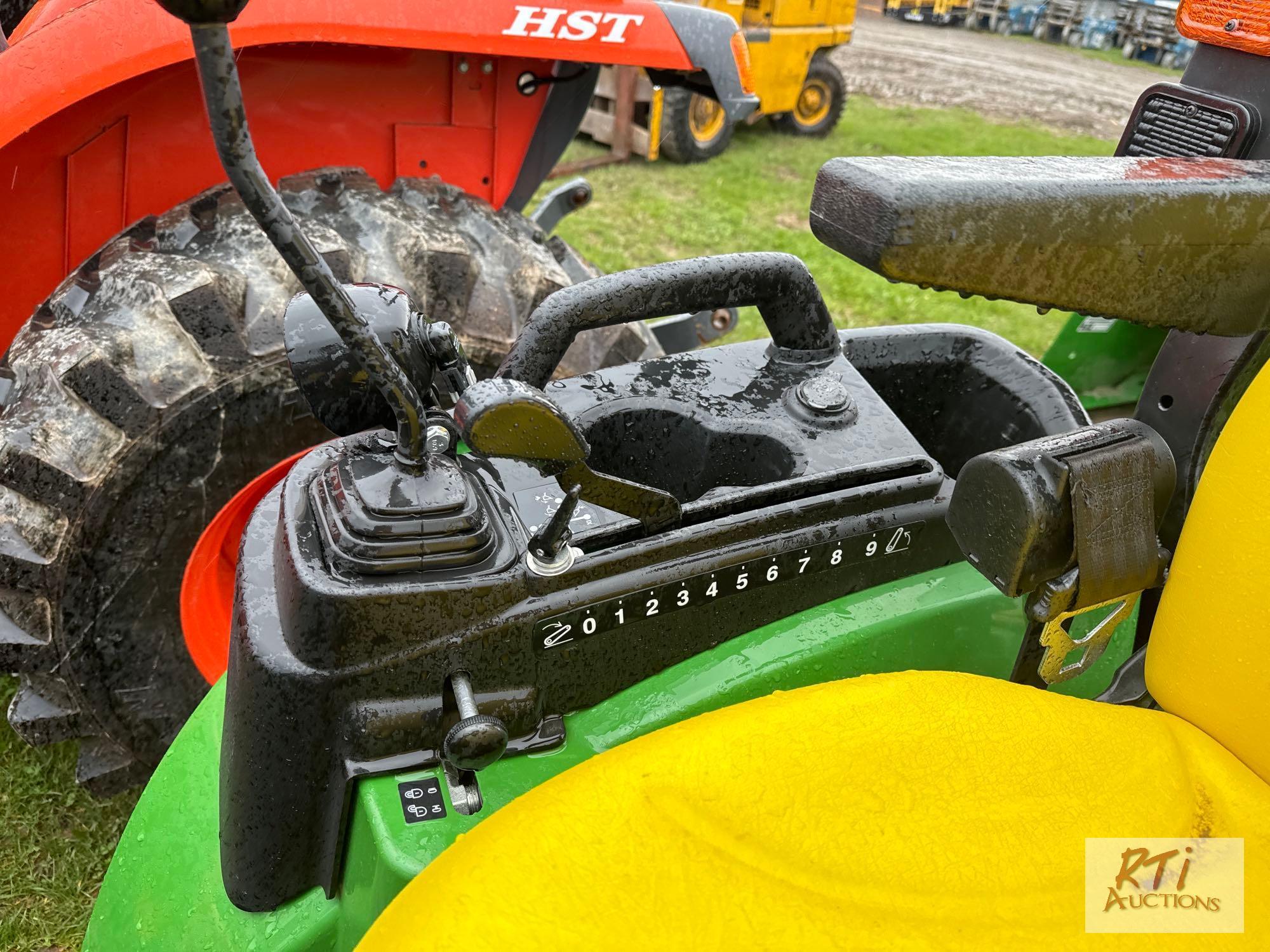 John Deere 2025R 4WD compact diesel tractor, with loader and quick attach bucket, 140hrs. Sells with