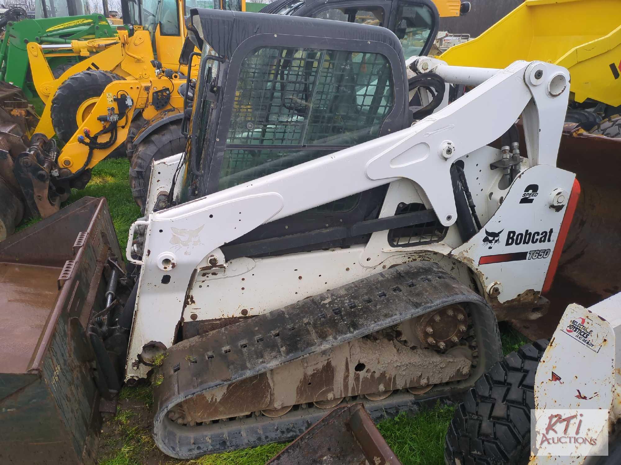 Bobcat T650 track skid steer loader, cab, GP bucket, power wedges, 2 speed, hand and foot controls,