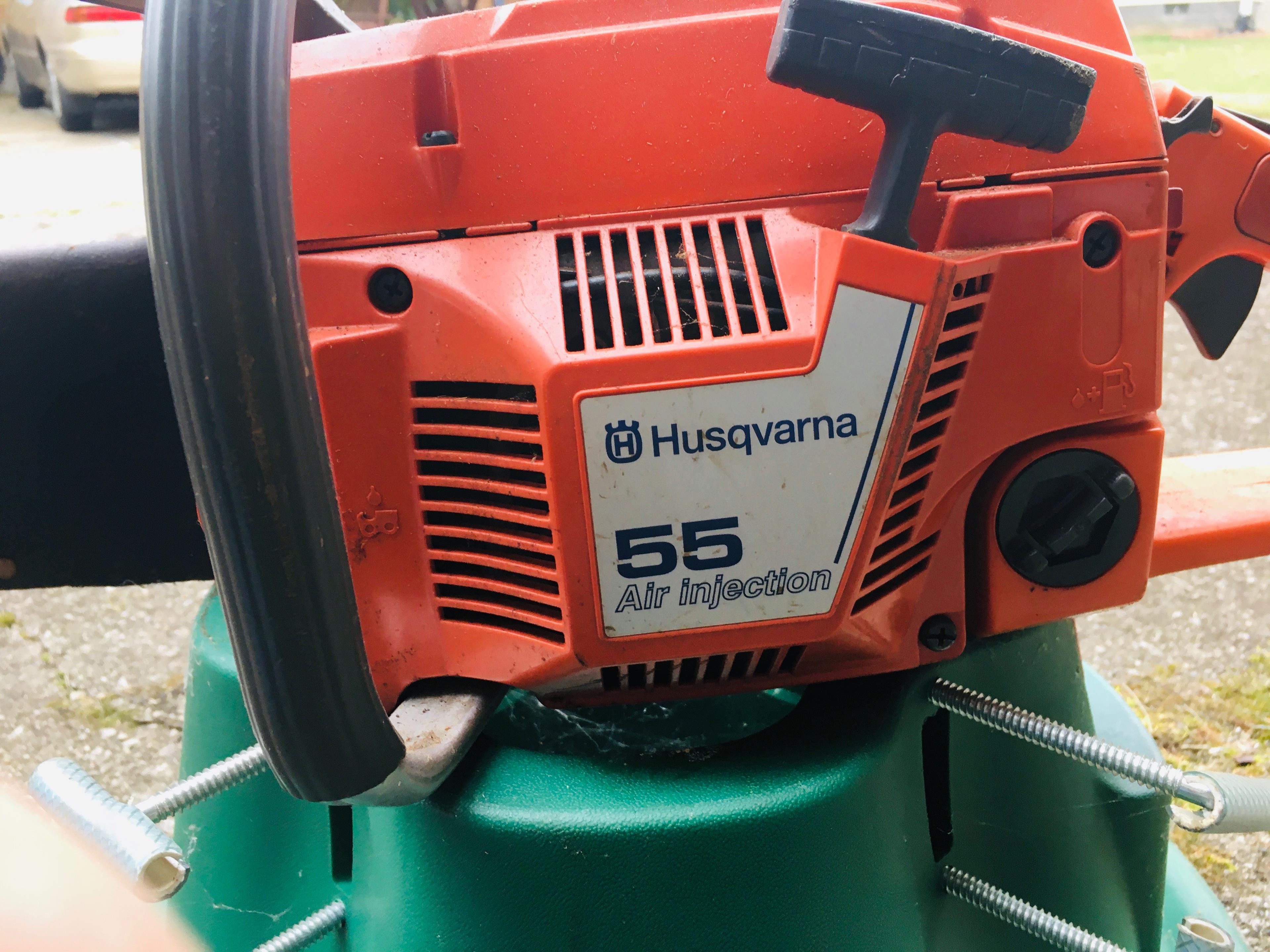 Husqvarna 55 Air Injection Chain Saw with Leather bar cover, chain, oil and Tree Stand