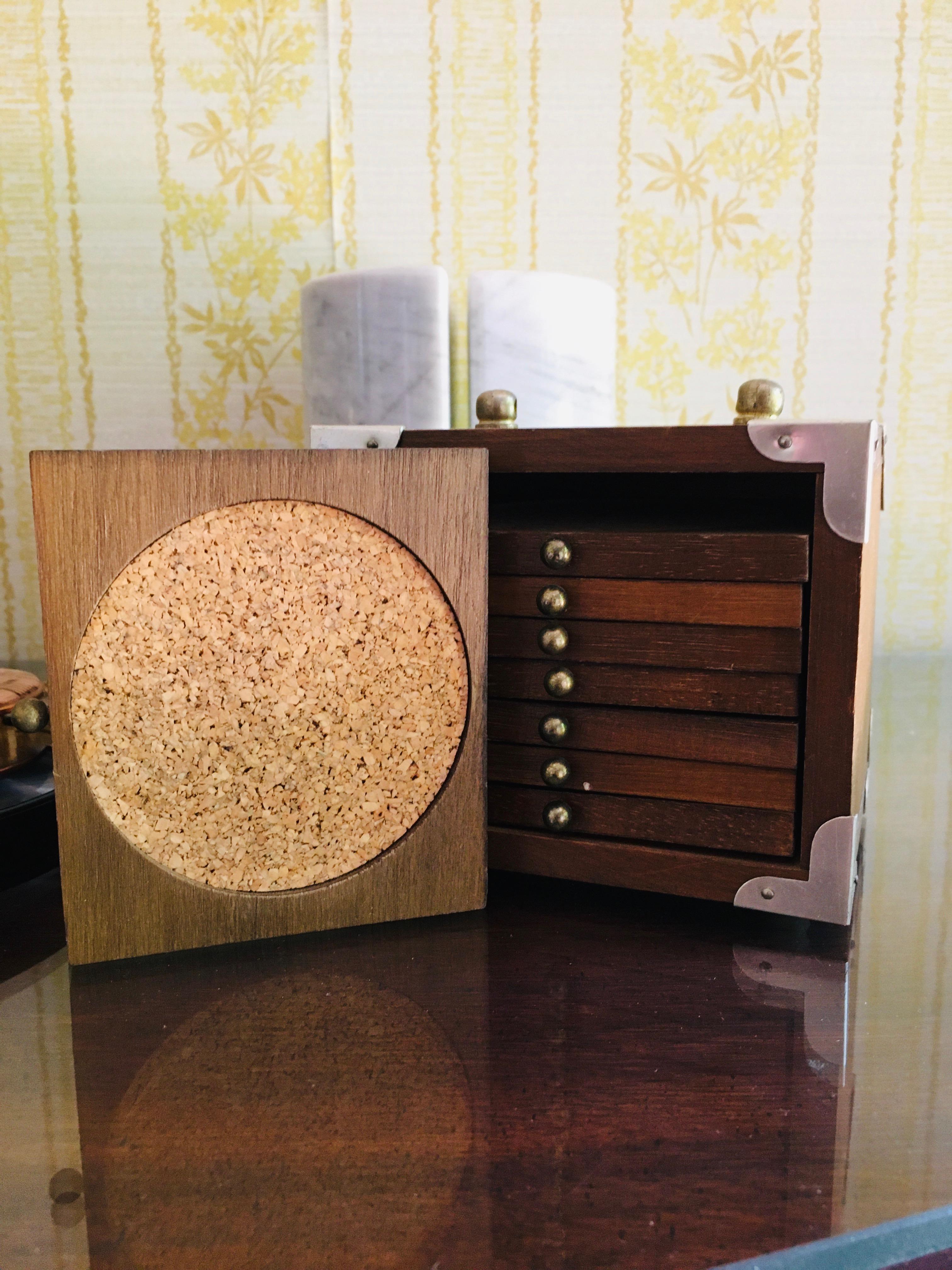 Marble book end magnifying glasses and stack of coasters in wooden case