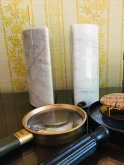 Marble book end magnifying glasses and stack of coasters in wooden case