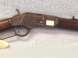 Model 1873 32 cal Winchester having original slide plate and octagon barrel  serial number 319577B