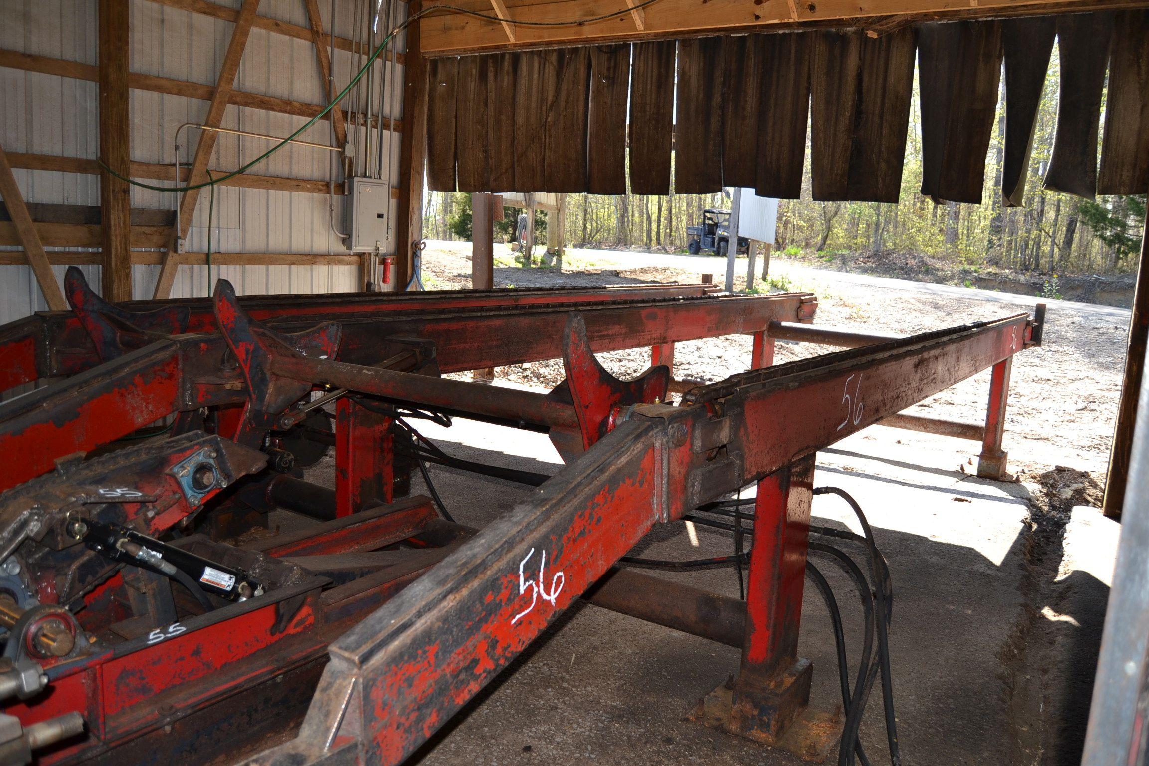 MELLOTT 24' 3 STRAND LOG DECK W/ 3 ARM STOP & LOADER W/ NOSE SKIDS W/ HYDRAULIC DRIVE