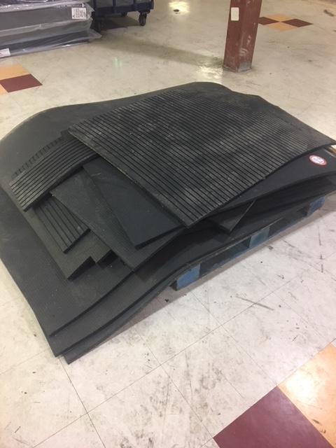 Contents of pallet various heavy floor mats