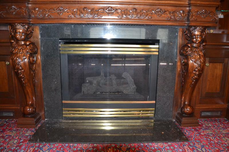Hand Carved Wooden Mantel, Mahogany with cherubs,  Heat N Glow Gas Insert,