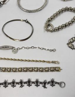 NINETEEN STERLING SILVER BRACELETS