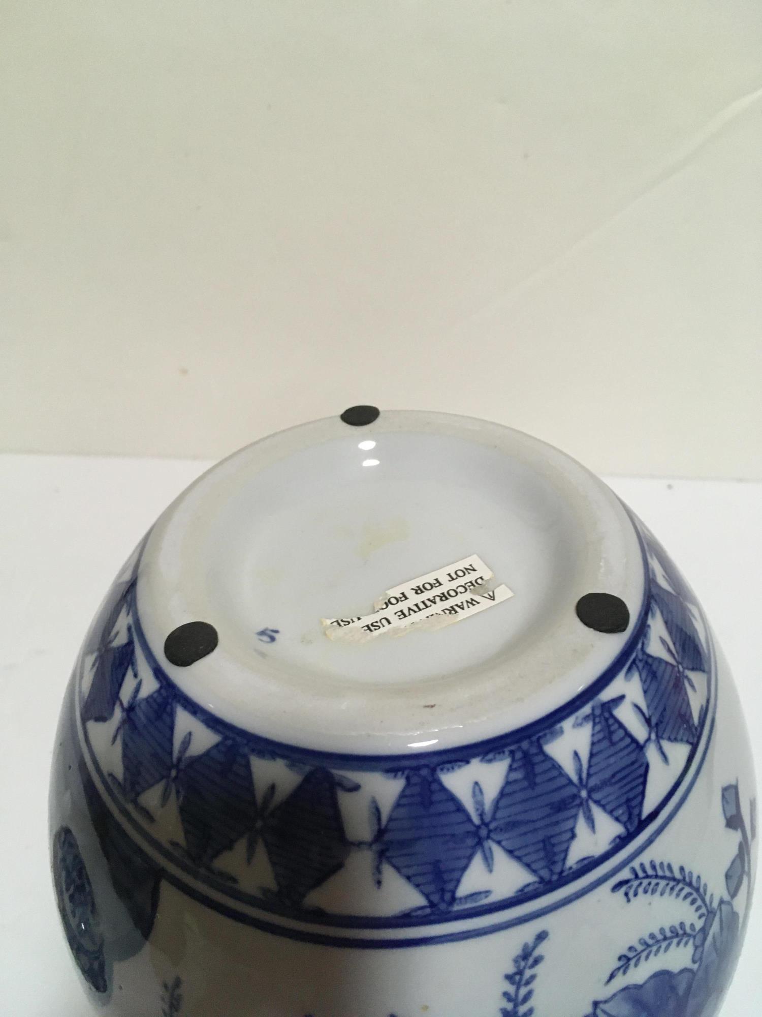 LIDDED BLUE AND WHITE ASIAN JAR W FLOWERS