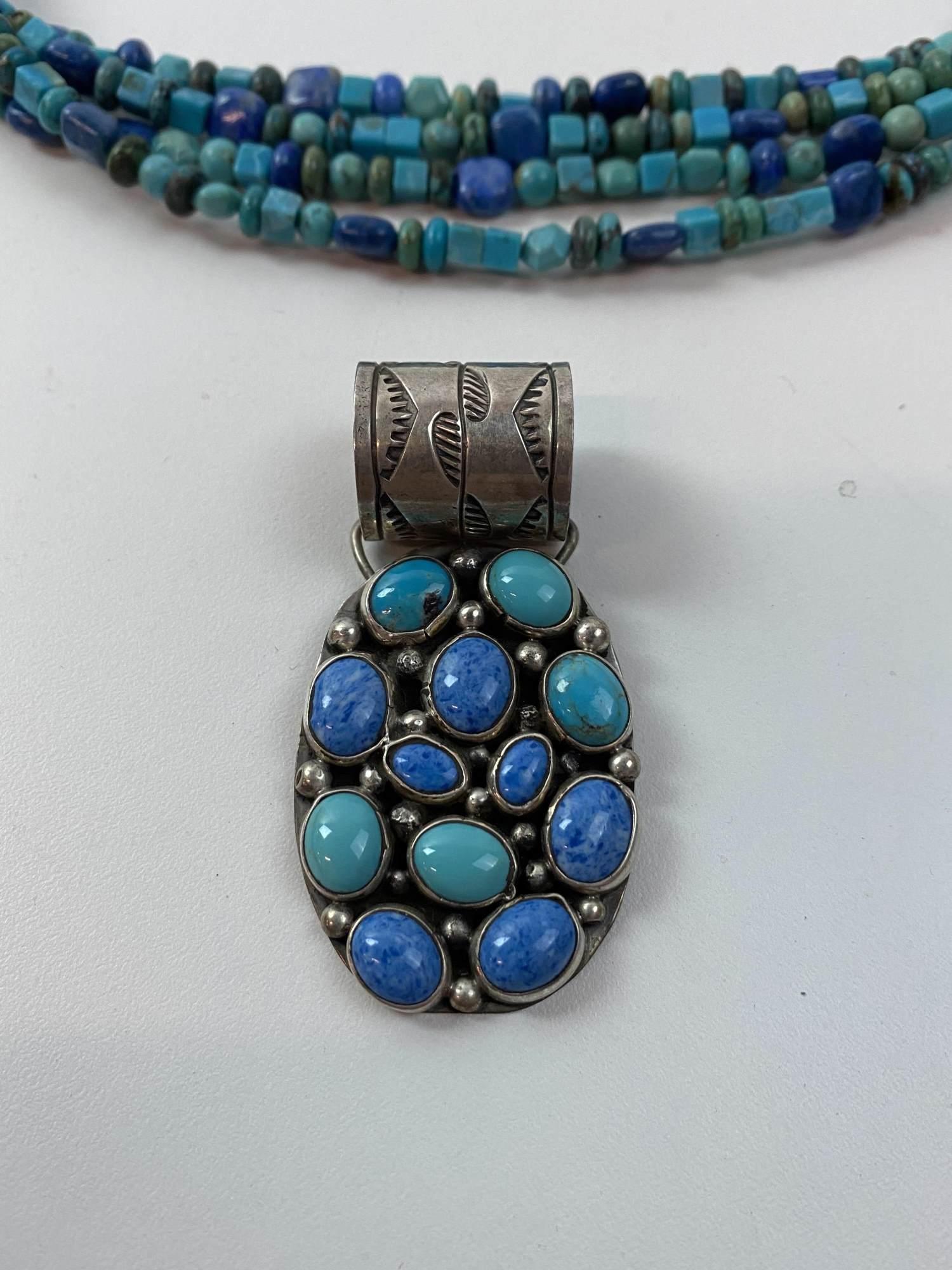 PAIR OF SOUTHWESTERN STERLING JEWELRY PIECES