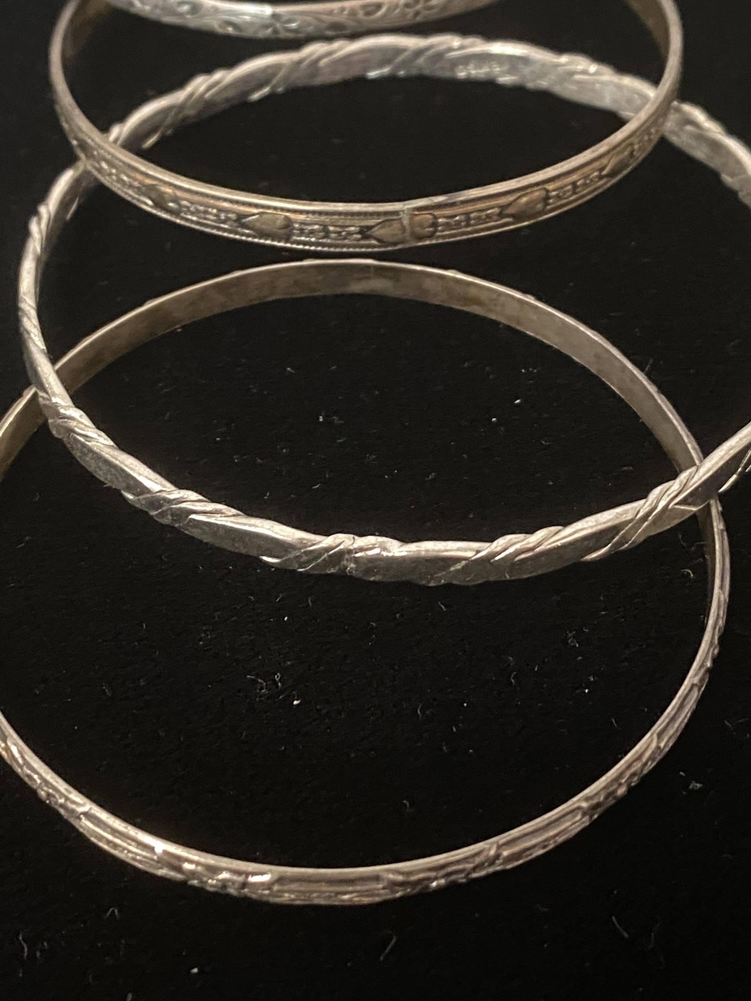 GROUP OF FIVE STERLING BRACELETS