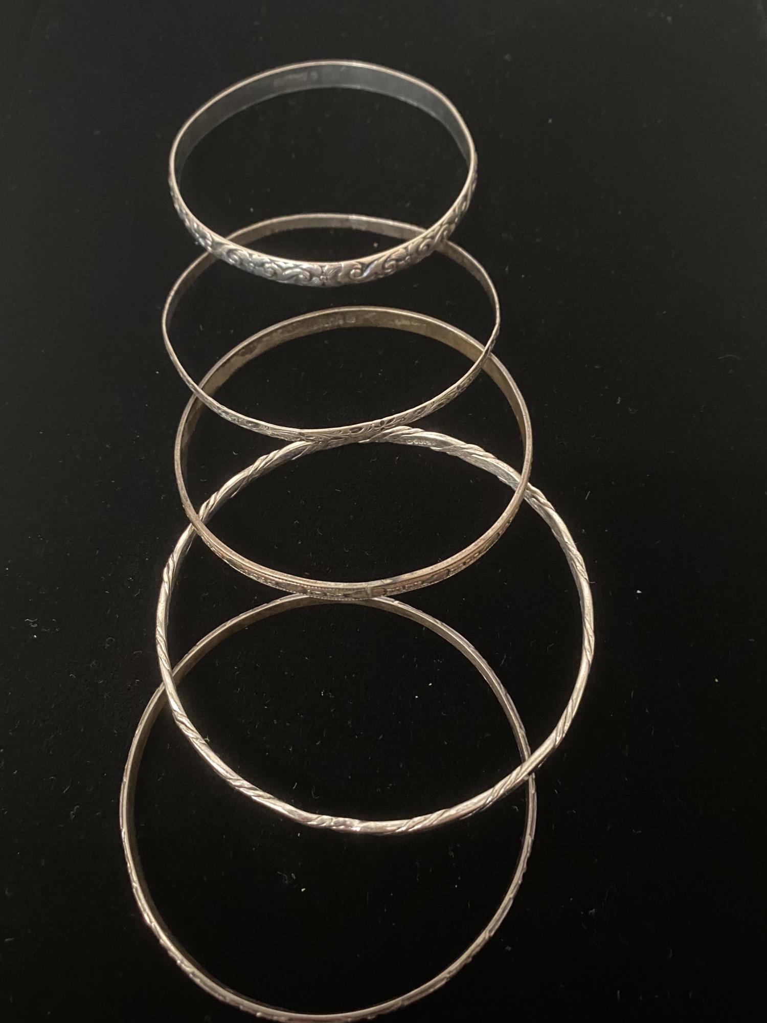 GROUP OF FIVE STERLING BRACELETS