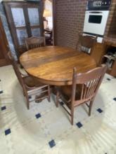 SINGLE PEDISTAL OAK TABLE AND FOUR CHAIRS