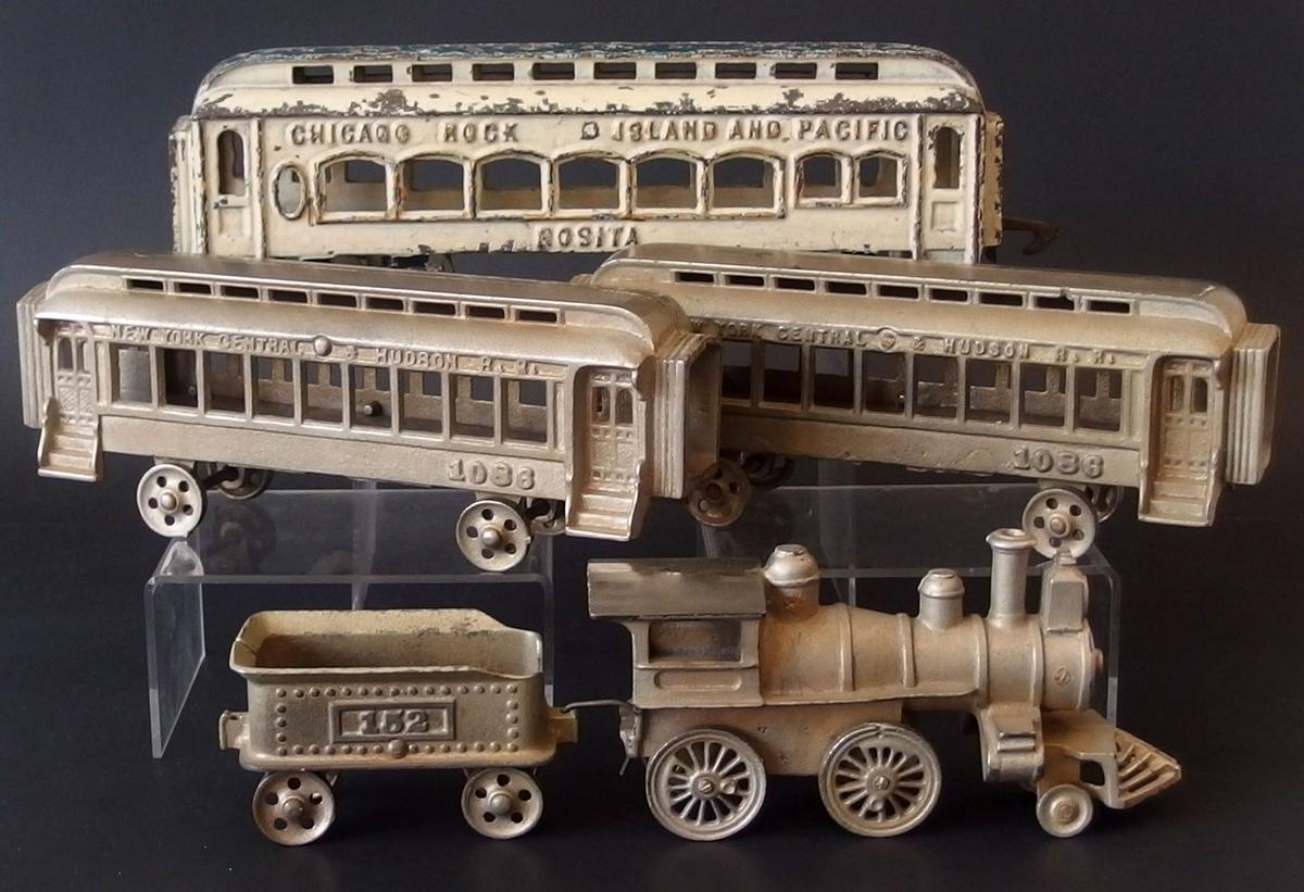 COLLECTION OF CAST IRON TOY TRAINS