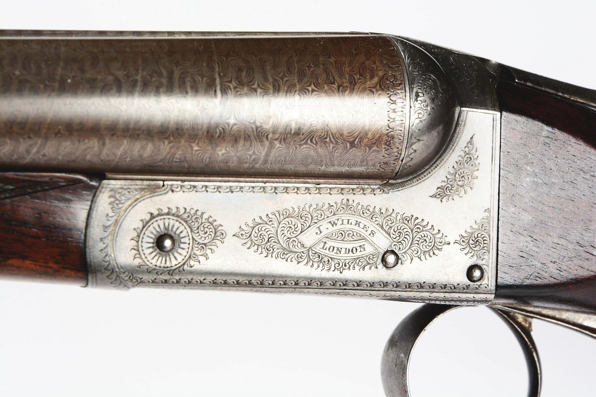 (A) English Boxlock Shotgun by Wilkes.