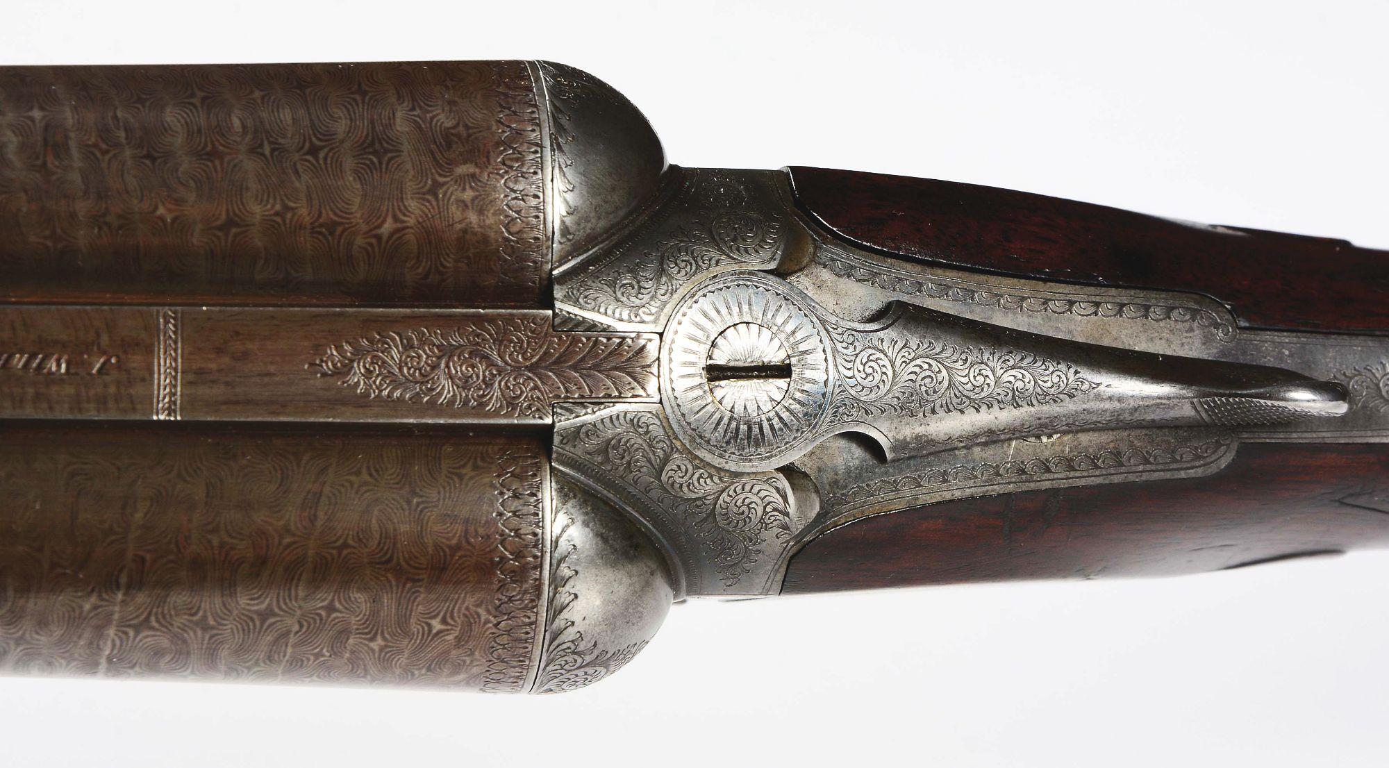 (A) English Boxlock Shotgun by Wilkes.