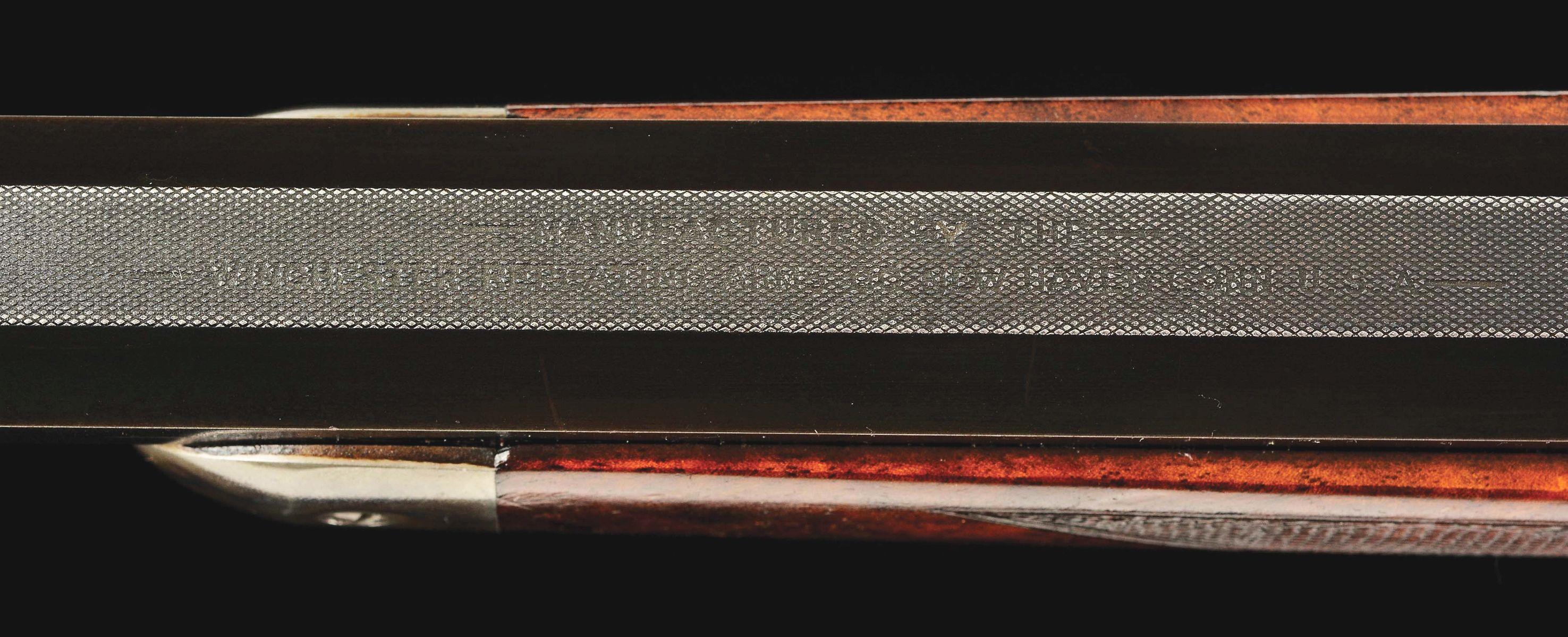 (A) DELUXE WINCHESTER MODEL 1886 LEVER-ACTION RIFLE WITH RARE 30-INCH MATTED BARREL.