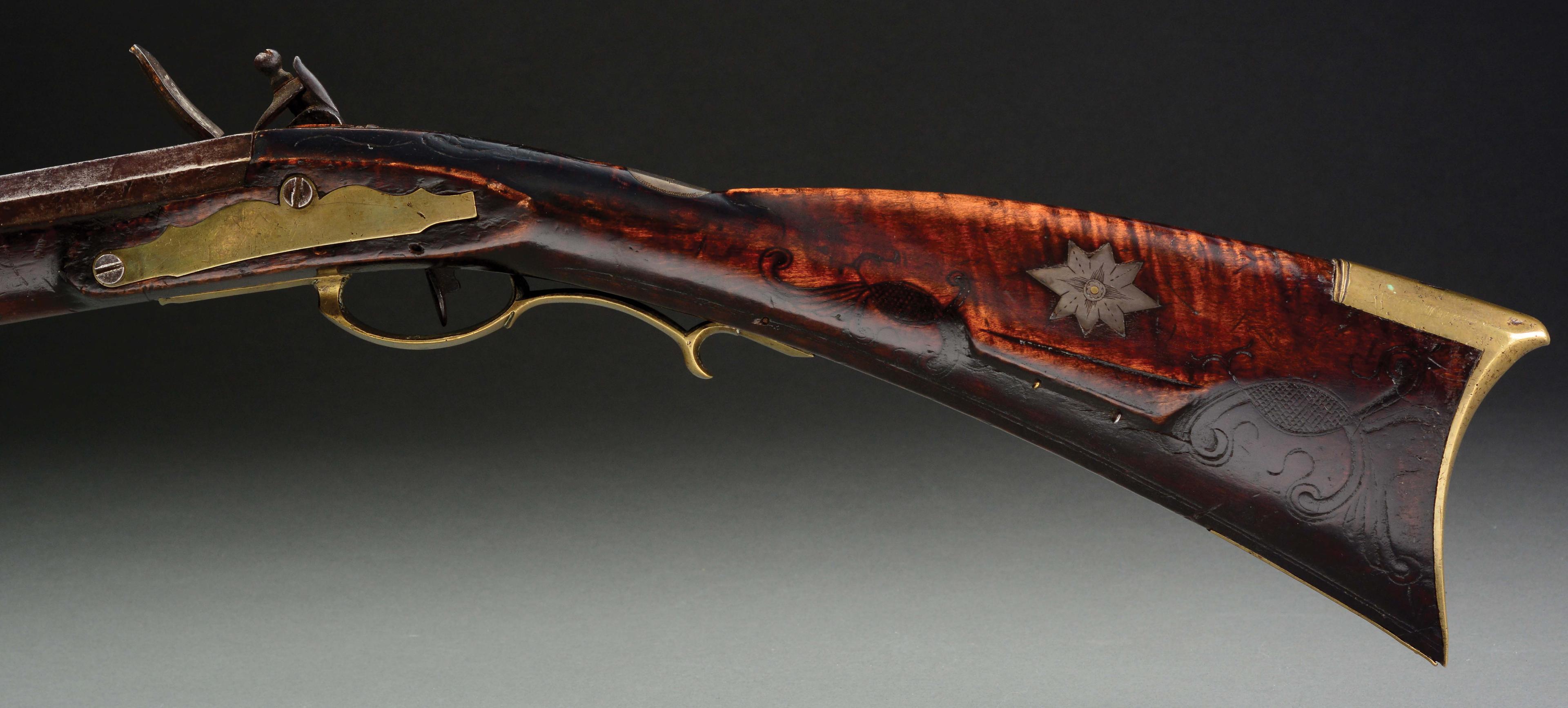 (A) Carved Berks County Flintlock Rifle Attributed to Adam Angstadt.