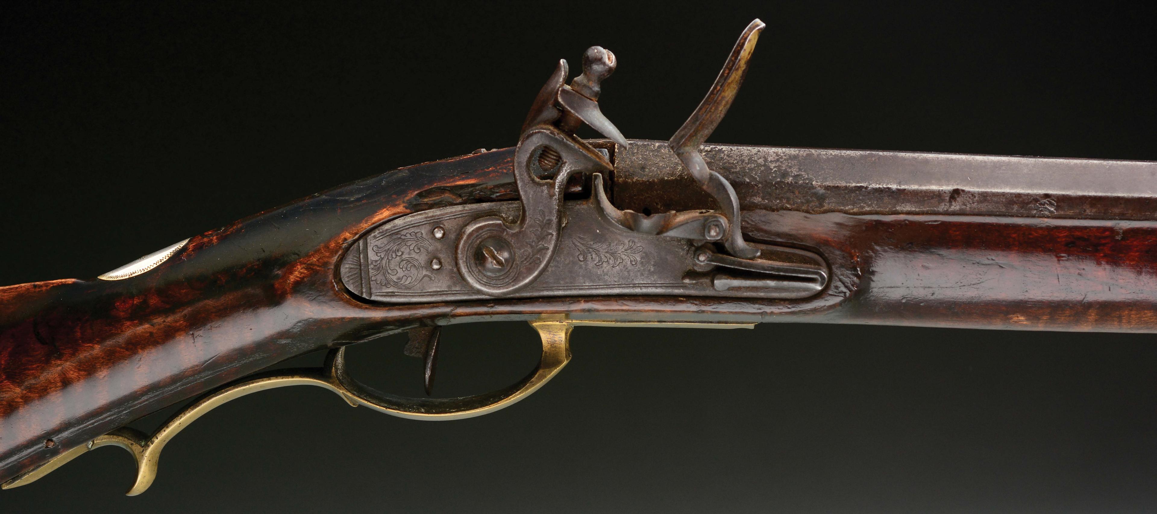 (A) Carved Berks County Flintlock Rifle Attributed to Adam Angstadt.