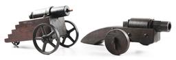 LOT OF 2: IRON CANNONS ON WOOD CARRIAGES.