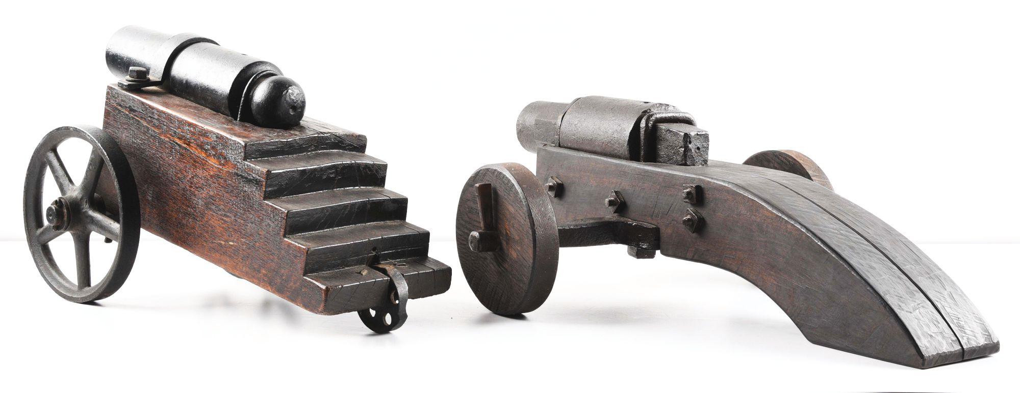 LOT OF 2: IRON CANNONS ON WOOD CARRIAGES.