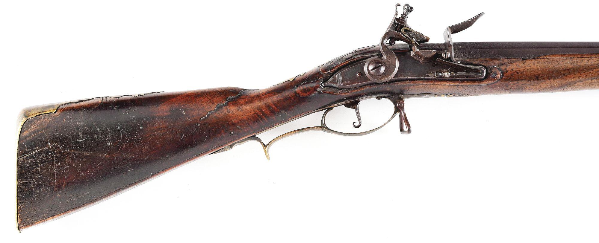 (A) EARLY CARVED FLINTLOCK KENTUCKY RIFLE.