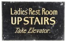 LADIES REST ROOM UPSTAIRS TAKE ELEVATOR HAND PAINTED TIN SIGN.
