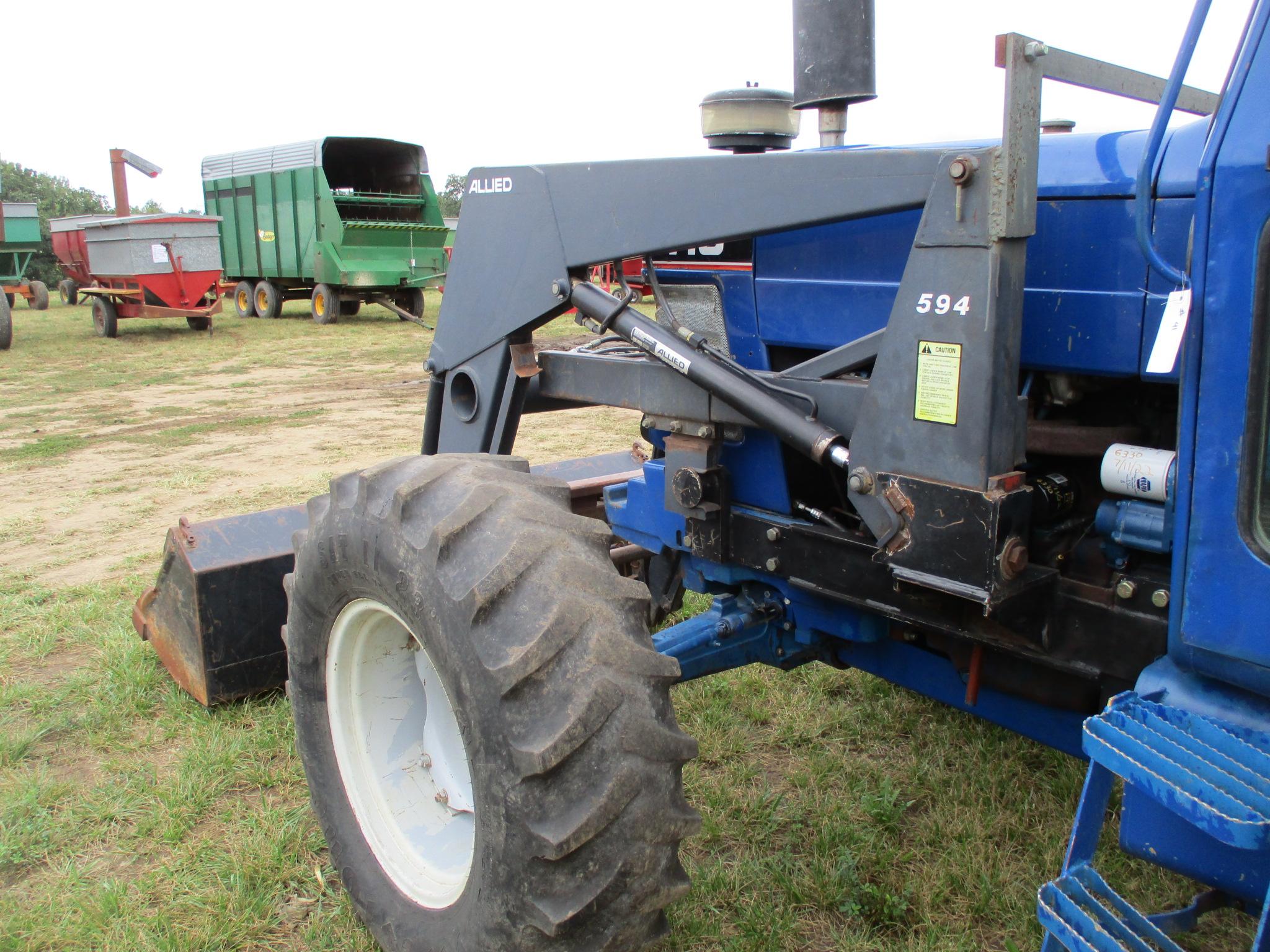 Ford 7710 MFWD, 6,333 Hrs. showing, cab, w/Allied 594  hyd loader 7' bucket & bale fork, 3pt. 3 hyd