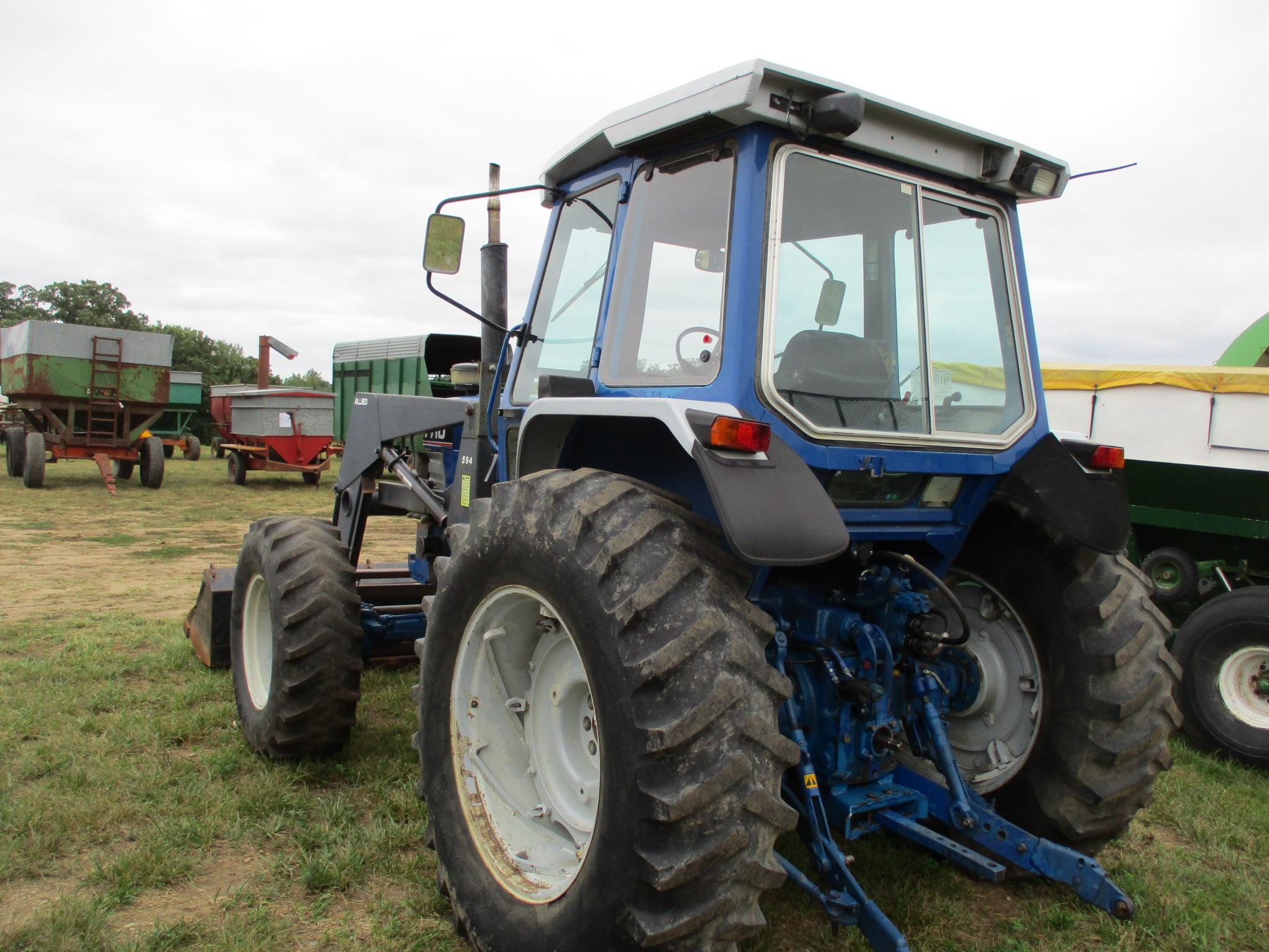 Ford 7710 MFWD, 6,333 Hrs. showing, cab, w/Allied 594  hyd loader 7' bucket & bale fork, 3pt. 3 hyd