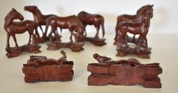 EIGHT HAND-CARVED WOODEN HORSES
