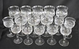 FOURTEEN CLEAR CUT STEMMED GLASSES