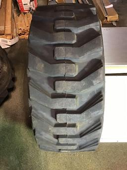 (4) CATERPILLAR Pneumatic Skid Steer Rims and Tires***LIKE NEW***