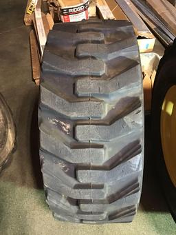 (4) CATERPILLAR Pneumatic Skid Steer Rims and Tires***LIKE NEW***